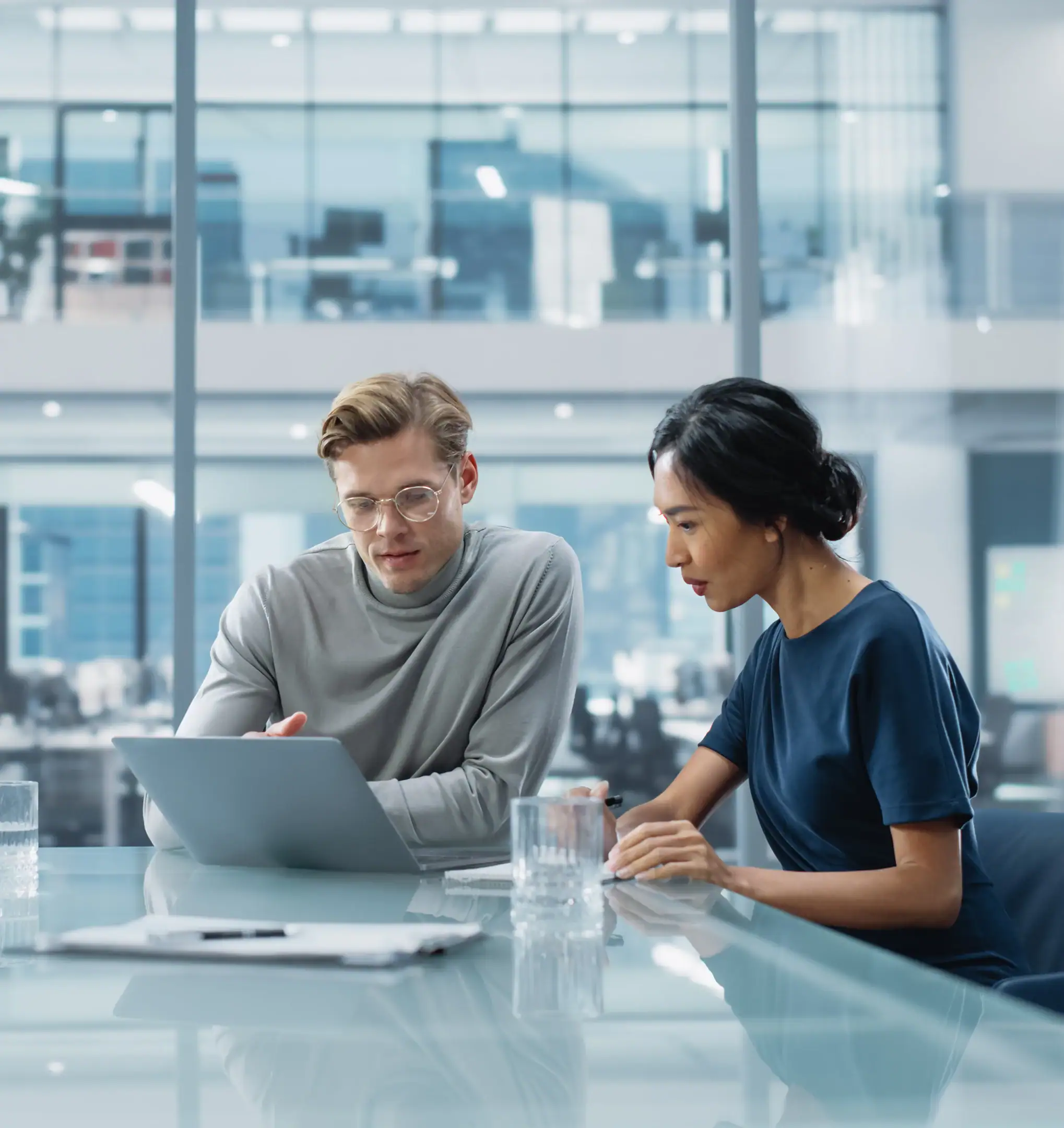 two business owners working at a computer